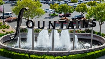 A fountain with the word "Fountains" written on it.